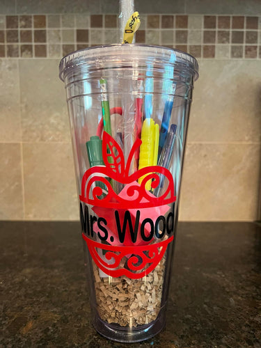 Large acrylic tumbler filled with pens, pencils, scissors, white board marker, eraser, post it!